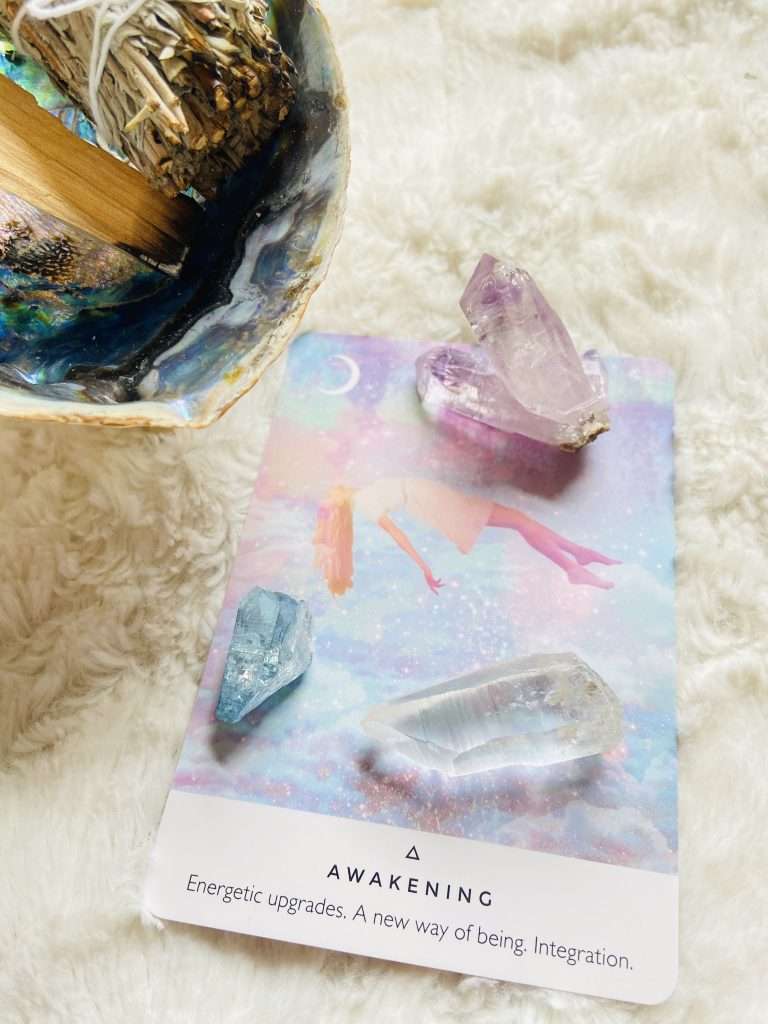Awaken oracle card with crystal